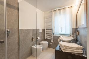 a bathroom with a shower and a toilet and a sink at valter rooms 1 in Castel del Piano +2 photos