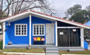 a blue shed with a couch in front of it at Chale ITU -Camping Carrion - Tomorrowland in Itu