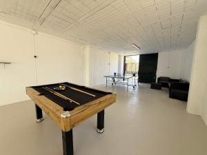 a room with a pool table in the middle of it at Casa Rural La Vega in Antequera