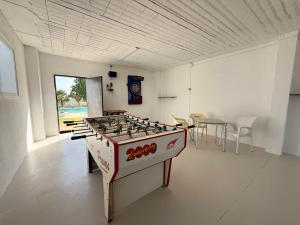 a room with a foosball table in the middle at Casa Rural La Vega in Antequera