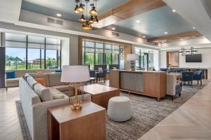 a living room with a couch and a table at Staybridge Suites Crestview South by IHG in Crestview