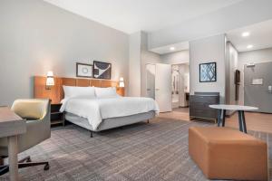 a hotel room with a bed and a desk at Staybridge Suites Crestview South by IHG in Crestview +28 photos