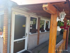 a front door of a house with potted plants at Pit - Stop  +13 photos