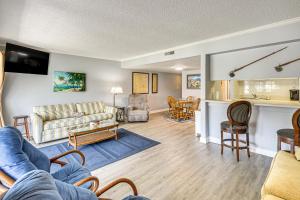 a living room with a couch and a table at Boat Dock, Slips & Pool! St Johns River Condo in Welaka