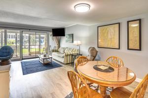 a living room with a table and chairs at Boat Dock, Slips & Pool! St Johns River Condo in Welaka