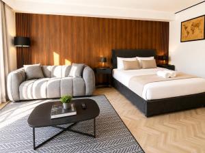 a hotel room with a bed and a couch at City Centre Oasis in Cape Town