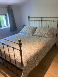 a bedroom with a bed with a metal frame at Atelier chambres in Semur-en-Auxois +10 photos