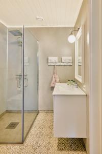a bathroom with a sink and a shower at Lodge Visnes Stryn in Stryn