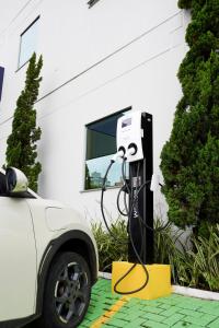 an electric car is plugged into a power meter at Hotel Gran Santa Catarina in Indaial