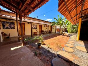 an outside view of a house with a patio at Pousada Canela de Ema in Mateiros