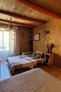 a bedroom with a large bed in a room at le relais de l'abelan in Blesle
