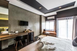 Cresco Hotel Buriram客房内的一张或多张床位