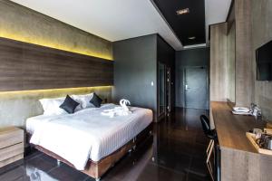 Cresco Hotel Buriram客房内的一张或多张床位