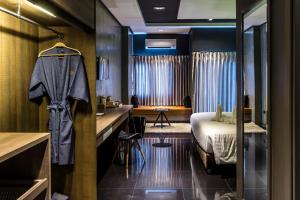 Cresco Hotel Buriram客房内的一张或多张床位