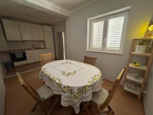 a kitchen with a table and chairs in a room at Room Blue View in Mlini +28 photos