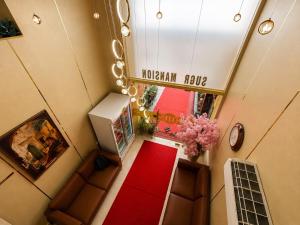 an overhead view of a hotel room with a red carpet at The Marina Palace Calicut Premium Beach Hotel in Kozhikode