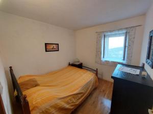 a bedroom with a bed and a window at Holiday Home Tomislav in Komiža +31 photos