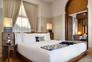 a bedroom with a large white bed in a room at Banyan Tree Tamouda Bay in Fnidek +280 photos