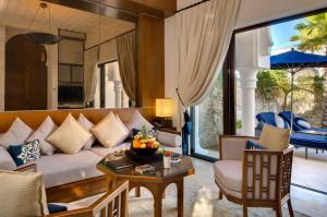 a living room with a couch and a table at Banyan Tree Tamouda Bay in Fnidek