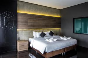 Cresco Hotel Buriram客房内的一张或多张床位