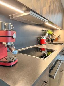 a kitchen with a mixer on a counter at JUPAS - Premium Apartments Trier in Trier