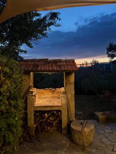 a stone fireplace with a roof on top of it at Casale Santilli in Agnone
