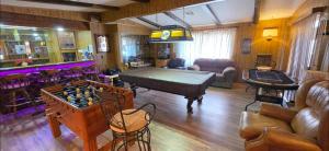 a living room with a ping pong table and a chess board at 4 River Lake Sea in Parker