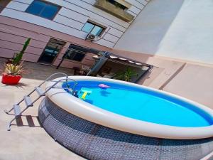 a large bath tub sitting in front of a house at Sudresidence in Agadir