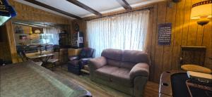 a living room with a couch and a chair at 4 River Lake Sea in Parker +84 photos