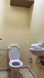 a bathroom with a toilet and a sink at Appartement Agadir in Inezgane