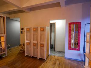 a room with lockers and a mirror on the wall at Casa Pepe in Mexico City