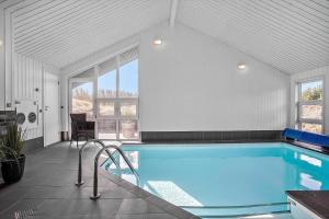 a large swimming pool in a white room with at 1005-Thisted-Spanggardsvej-39 in Torsted