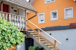 a stairway leading up to a house with a building at Fewo zum Ritzli in Ettenheim
