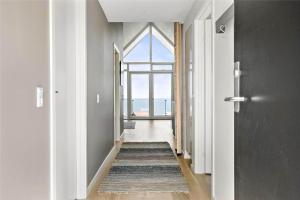an empty hallway with a large window and a rug at 791-Thisted-Havstokken-12-1 in Thisted