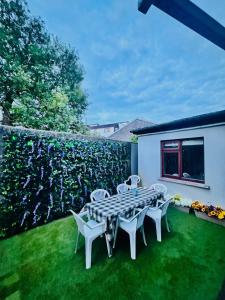 a table and chairs sitting on a lawn at The Ambassador Apartment in Carrick on Shannon