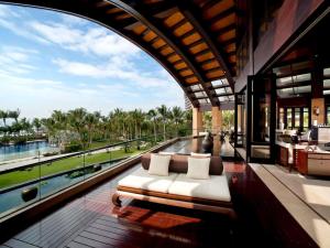 a couch sitting on the floor of a building at Pullman Oceanview Sanya Bay Resort & Spa in Sanya