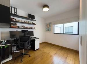an office with a desk and a computer in a room at David House 3BR Pent Mira in Lima