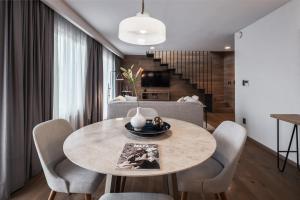 a dining room with a table and chairs at Frida by Viadora in Mexico City