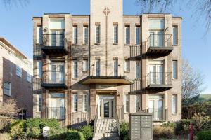 an apartment building with balconies on the side of it at Music Row Luxury Suites - Two King Bedrooms - Private Garage & Ensuite Baths in Nashville