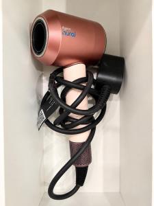 a blow dryer with a hose attached to a persons arm at Oceanfront Escape with Private Bath and Beach Access in Gibsons