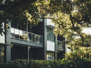 a building with a balcony on the side of it at The Sebel Kiama in Kiama