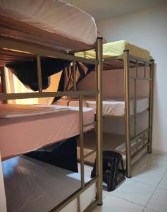 a couple of bunk beds in a room at Multiverse Hostel in Medellín