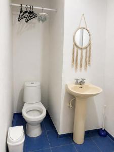 a bathroom with a white toilet and a sink at Miss Titi's Native Lodge in San Andrés +75 photos