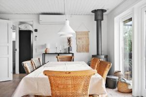 a dining room with a table and chairs at 7032-Bogo-Kvaernen-32 in Gammelby +18 photos