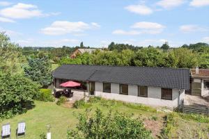 an aerial view of a house with a yard at 4035-Borre-Bogebjergvej-15 in Borre