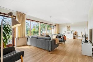 a living room with two couches and a tv at 4035-Borre-Bogebjergvej-15 in Borre
