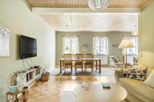 a living room with a couch and a table at 4302-Stege-Nordfeldvej-48-B in Stege