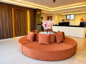 a large circular couch sitting on the floor in a lobby at Oceana Mazagan Suites Hôtel in El Jadida +34 photos