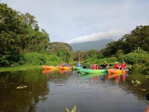 a group of people in kayaks on a river at Sunny Garden Lodge in Mérida