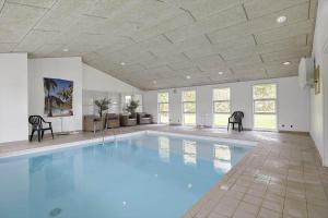 a large swimming pool in a room with a ceiling at HA364-Hals-Hou-Mose-19 in Hals